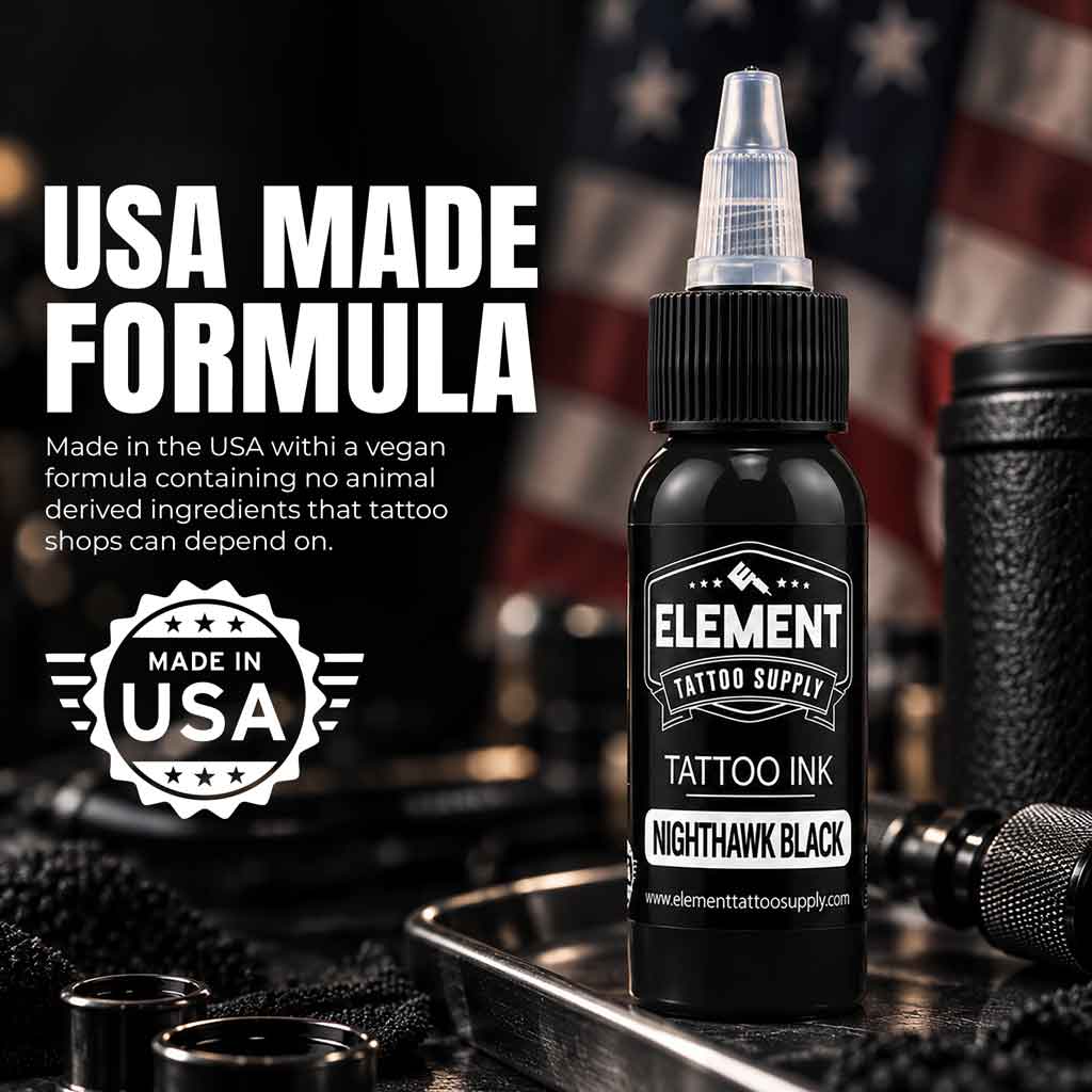 A bottle of Element Tattoo Supply Nighthawk Black tattoo ink stands on a tray in a styled studio setup with a blurred American flag and tattoo tools in the background. Large text on the left reads 'USA MADE FORMULA' with a 'Made in USA' badge below.