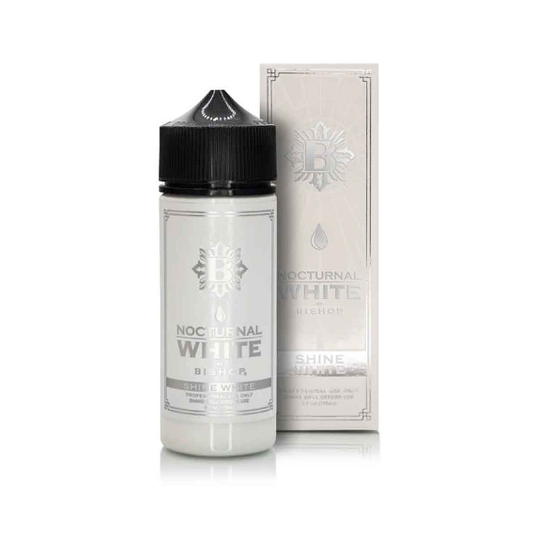 Vape juice bottle with black cap and white label next to its packaging on a white background