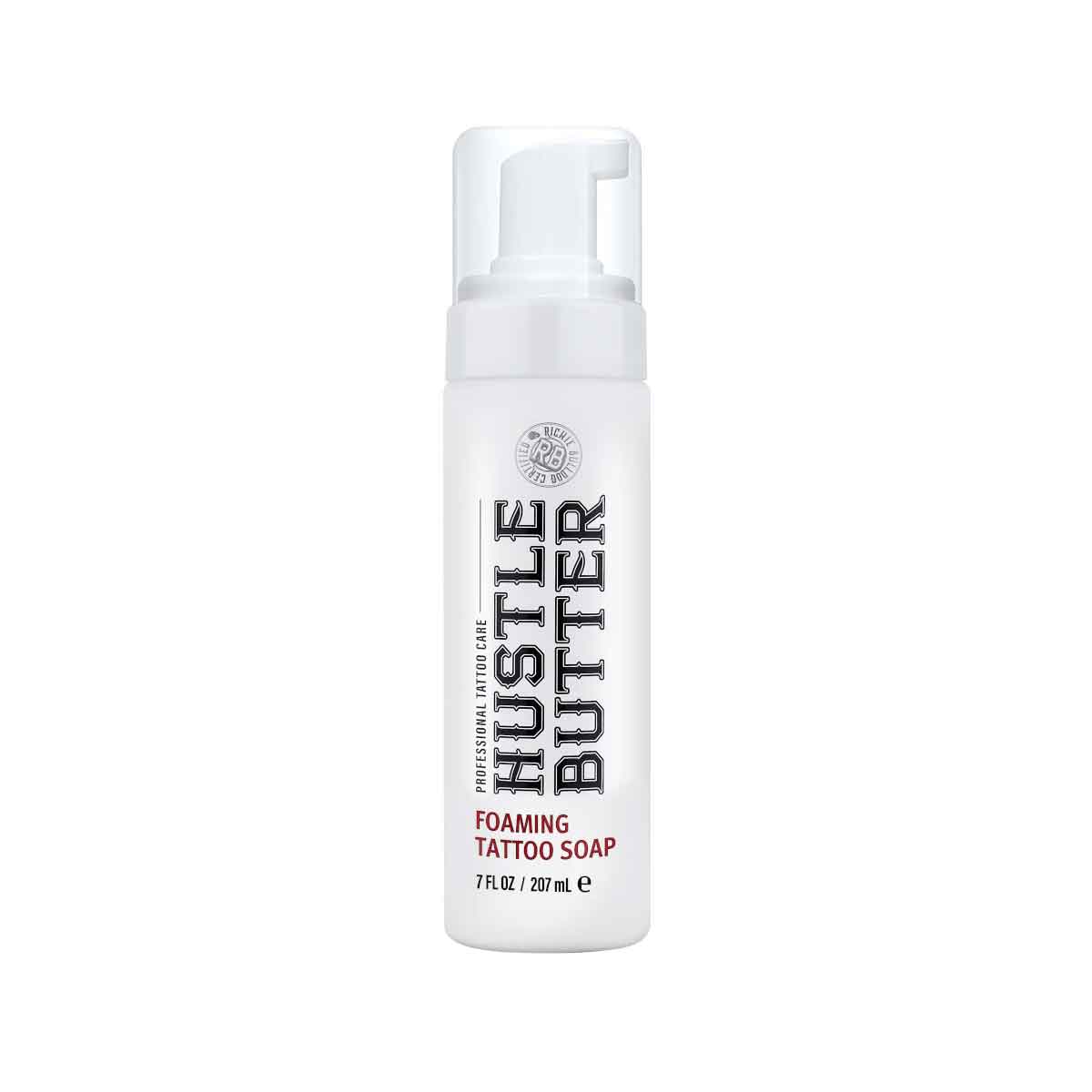 Foaming tattoo soap bottle labeled 'Hustle Butter' on a white background